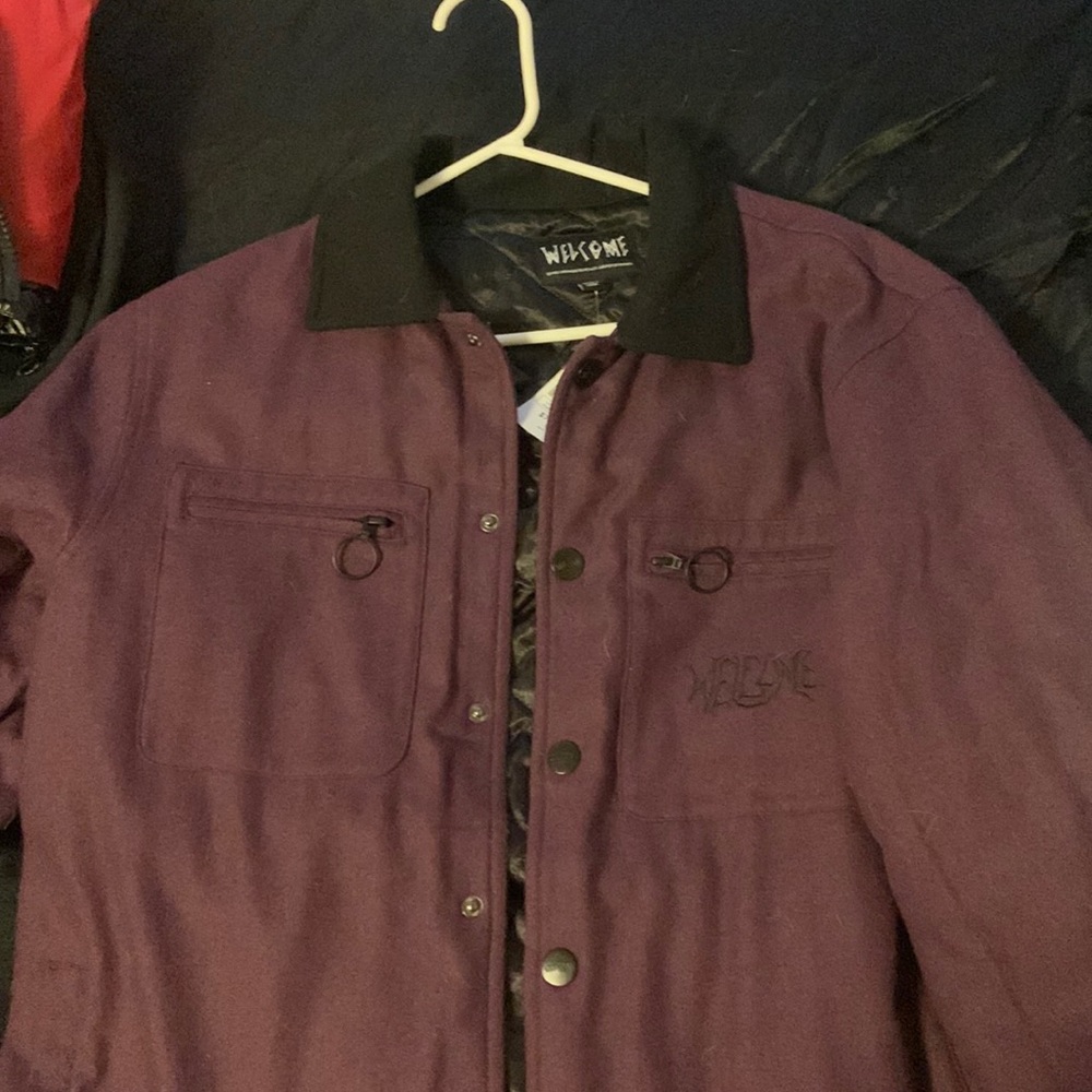 I’m selling a dark purple welcome brand coat